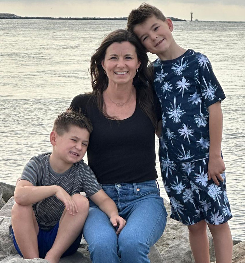 Katie Wilson with her two sons by the water